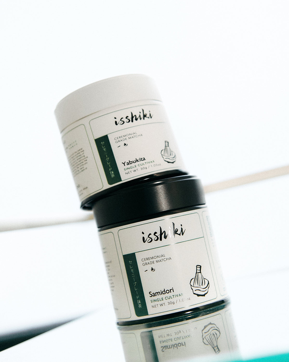 Two cylindrical containers labeled 'ishiki' on a white background