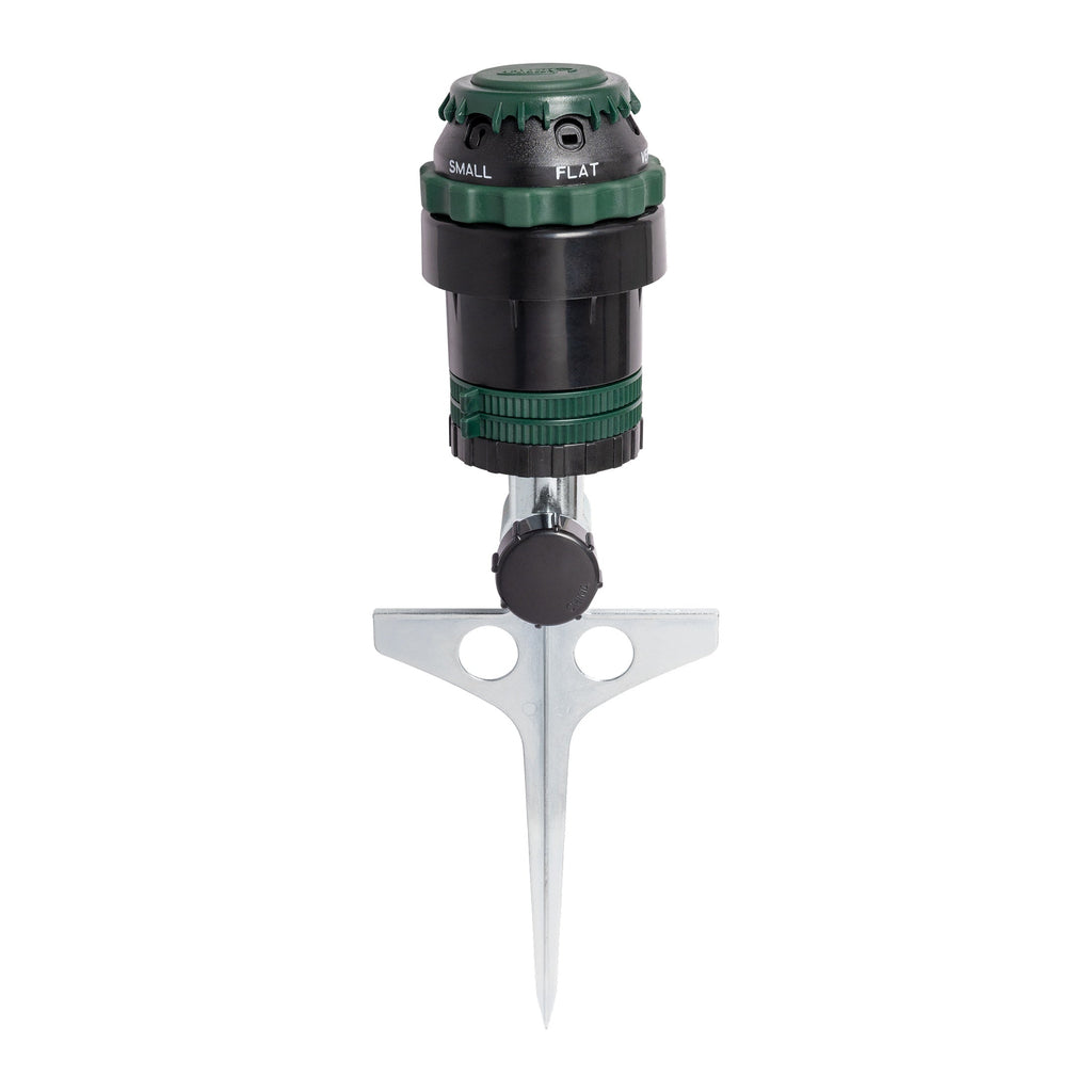 A garden hose nozzle with a silver metal ground spike, featuring a black and green adjustable head with 'SMALL' and 'FLAT' markings.