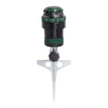 A garden hose nozzle with a silver metal ground spike, featuring a black and green adjustable head with 'SMALL' and 'FLAT' markings.