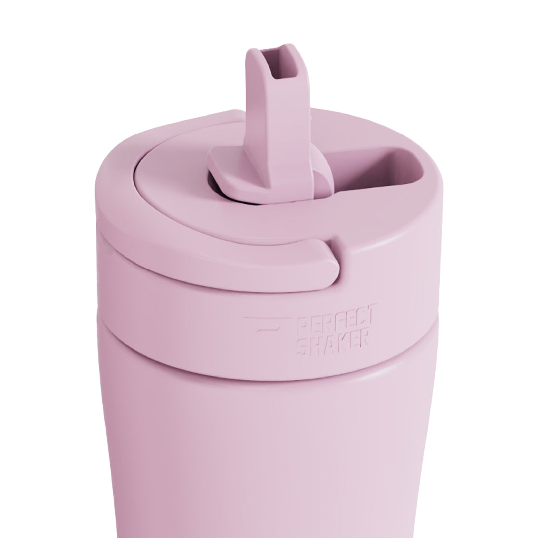 Pink tumbler with a lid on a white background
