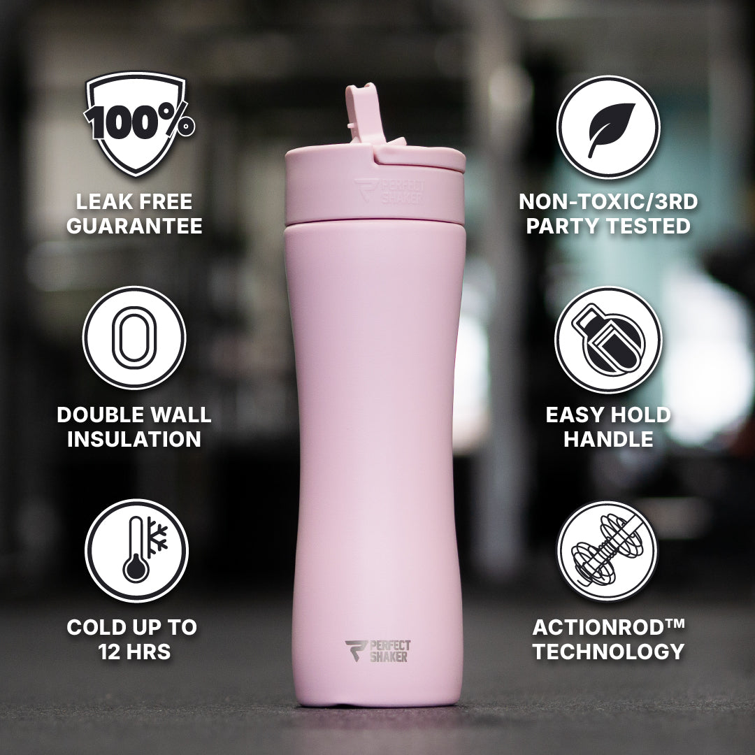 A light pink insulated travel tumbler with a flip-top lid, centered on a dark blurred background with feature callouts around it. The text includes '100% Leak Free Guarantee,' 'Non-Toxic/3rd Party Tested,' 'Double Wall Insulation,' 'Easy Hold Handle,' 'Cold Up to 12 Hours,' and 'ActionRod Technology.