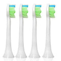 Four replacement toothbrush heads arranged in a row on a white background, featuring white handles and bristles with green, white, and blue coloring.