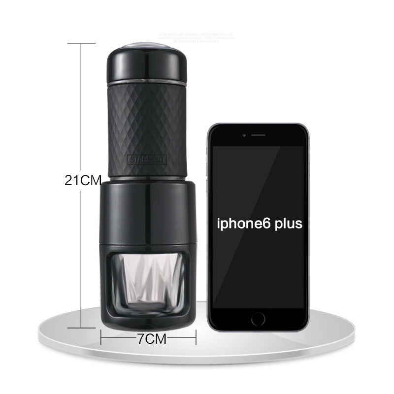 Black portable manual espresso coffee maker with compact 21cm x 7cm travel design, pressure brewing system and reusable glass cup for rich espresso and coffee at home, office, camping or travel.