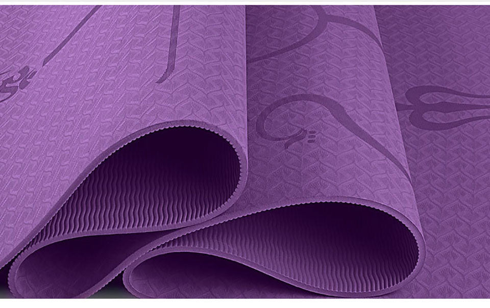 Purple yoga mat with textured pattern