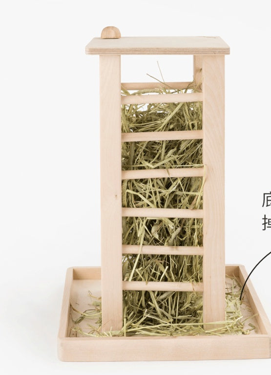 Wooden pet rabbit stand with hay on a white background