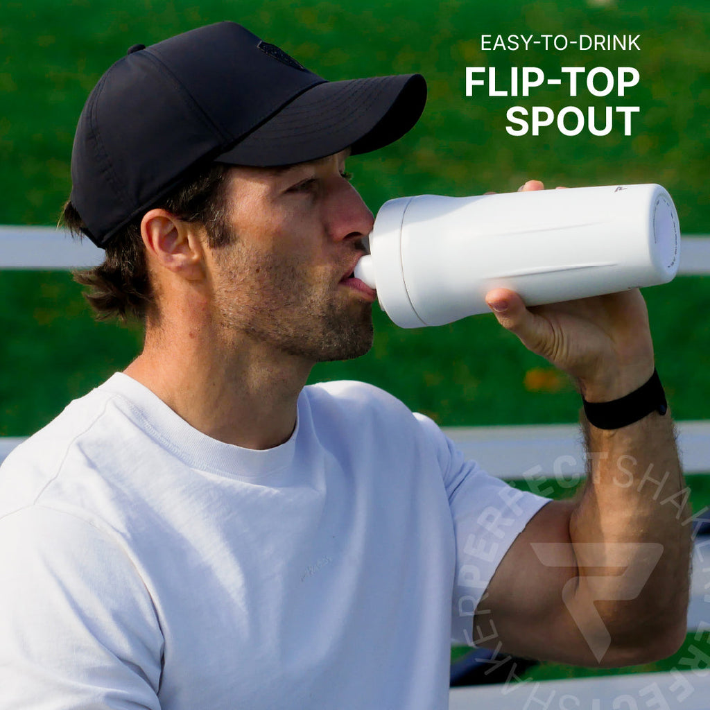 A man in a black baseball cap and white t-shirt drinking from a white flip-top spout bottle, with text overlay reading 'EASY-TO-DRINK FLIP-TOP SPOUT'.
