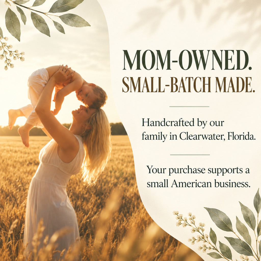 A warm promotional graphic with a woman in a white dress holding a child above her head in a golden field at sunset. Large text on the right reads, 'MOM-OWNED.