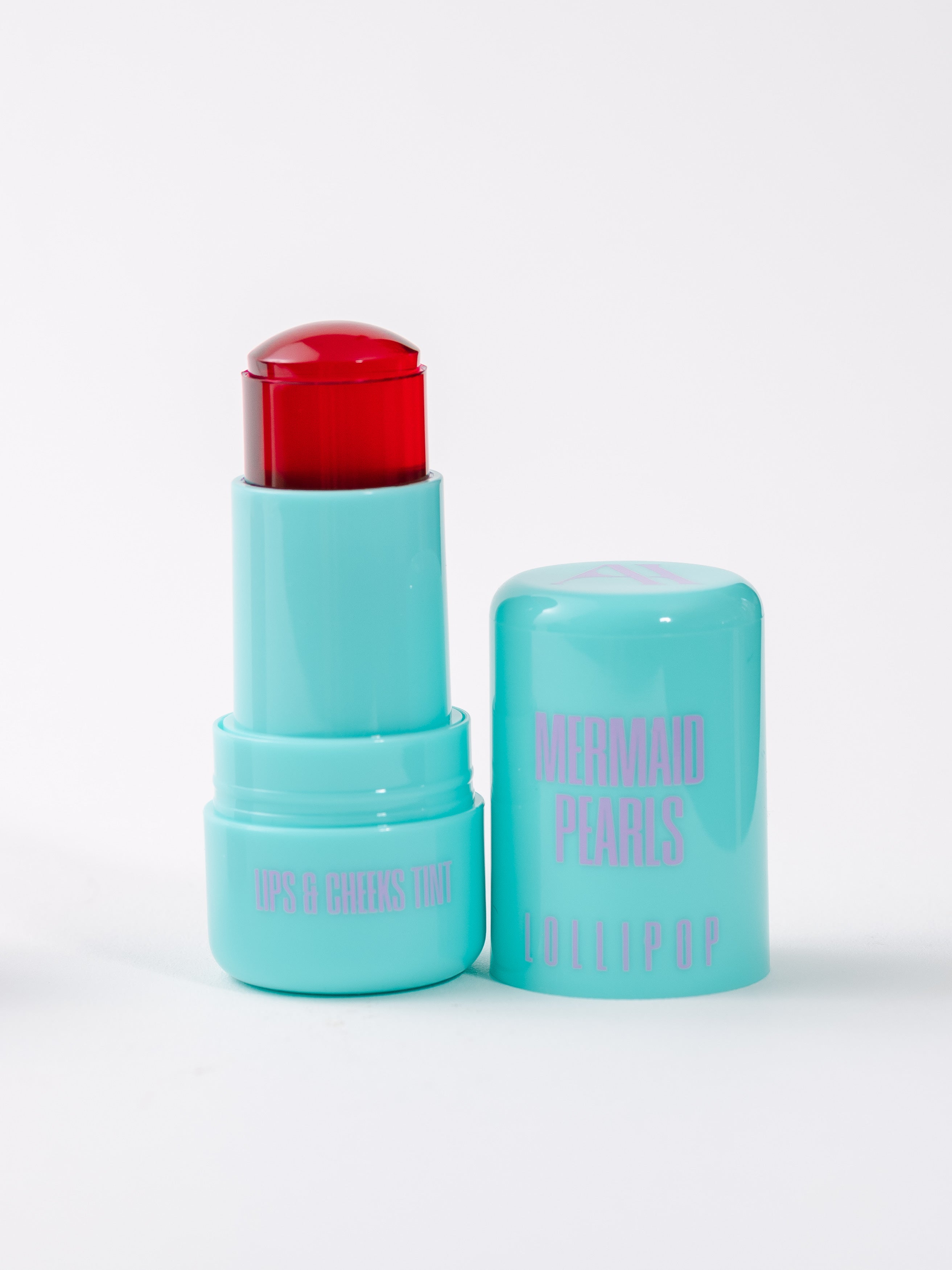 Mermaid Pearls LOLLIPOP Berry Lip & Cheek Tint in aqua twist-up tube with translucent berry jelly tint, hydrating multi-use makeup for lips and cheeks, buildable rosy color, vegan, cruelty-free, clean beauty.