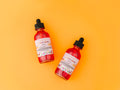 Frut Loops Body Oil by a female-owned brand featuring clean beauty, cruelty-free, vegan skincare with natural ingredients. Lightweight nourishing body oil enriched with niacinamide, licorice extract, and vitamin C for radiant, hydrated, glowing skin with a sweet fruity cereal-inspired scent.