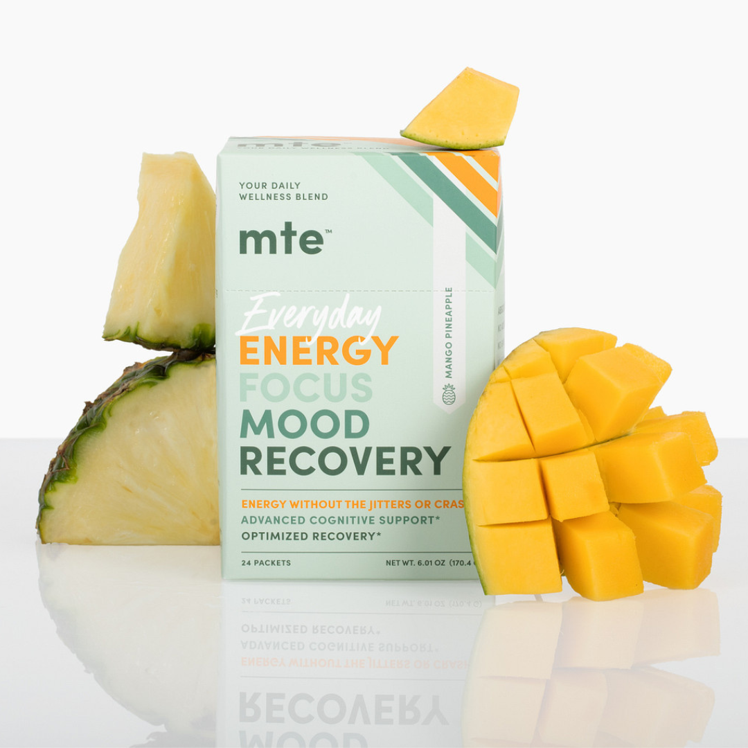 MTE supplement box with pineapple and mango on a white background
