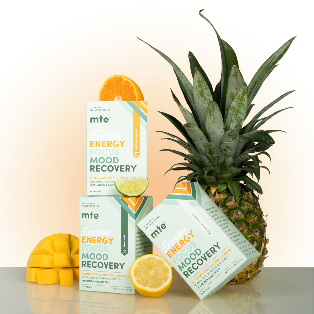 mte energy, focus, mood, recovery supplement boxes with a pineapple, lemon, and orange on a light background