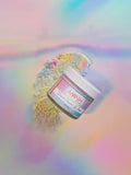 "Unicorn Dreams" Lip Scrub-"Unicorn Dreams" Lip Scrub in glass jar with rainbow sugar scrub on iridescent background, vegan clean beauty lip exfoliator made with natural ingredients, cruelty-free skincare by a female-owned brand.
