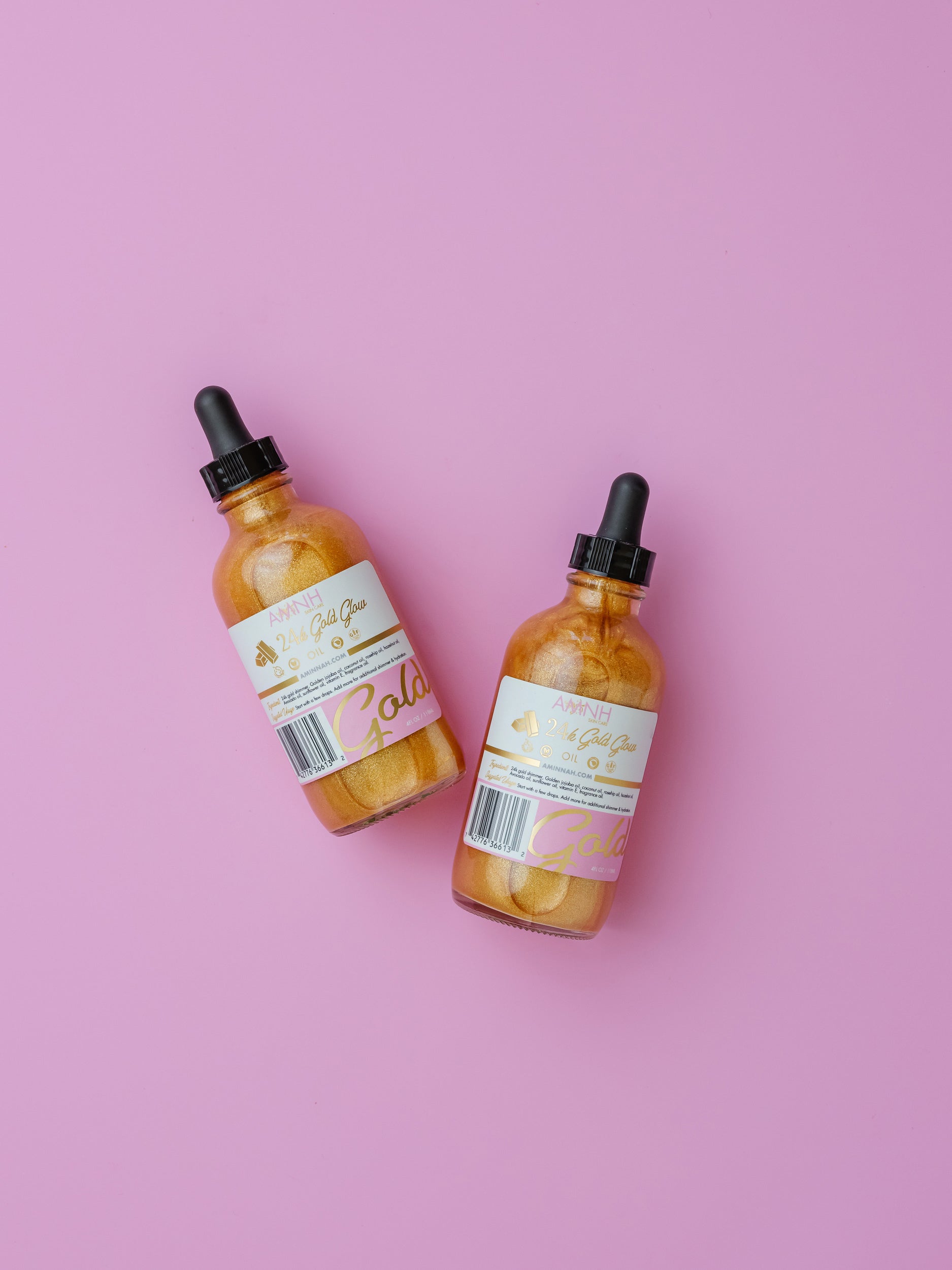 24K Gold Glow Body Oil duo from the 24K Gold Bundle featuring clean beauty, cruelty-free, vegan skincare made with natural ingredients from a female-owned brand for radiant, glowing skin.