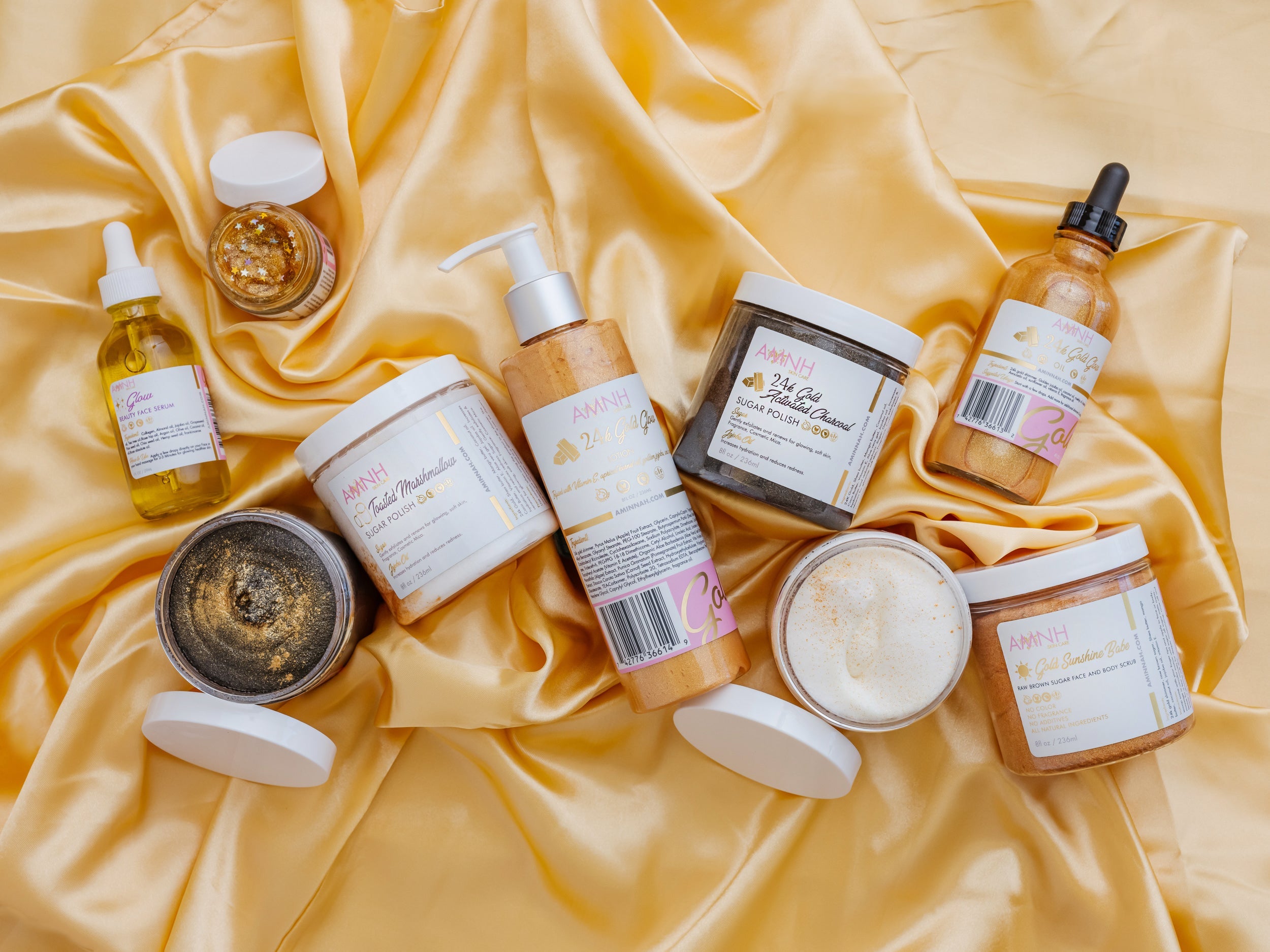 24K Gold Bundle skincare collection featuring clean beauty, cruelty-free, vegan body oil, glow lotion, sugar scrub, whipped body butter, and polishing scrub made with natural ingredients. Female-owned brand offering luxurious self-care essentials for soft, radiant, hydrated, glowing skin.