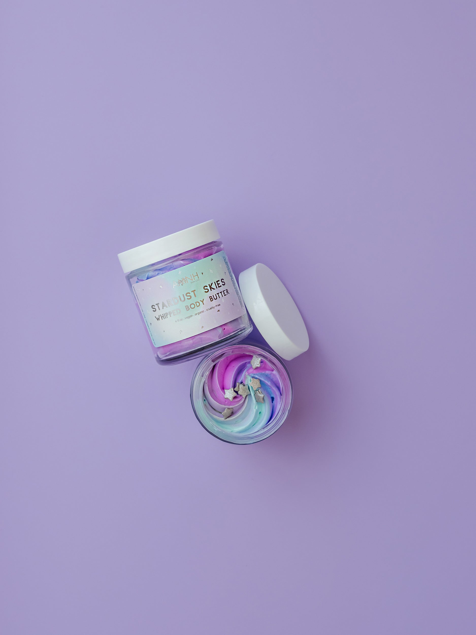 "Star Dust Skies" Whipped Body Butter in recyclable packaging with natural ingredients for deep hydration and silky-soft skin. Clean beauty, cruelty-free, vegan, paraben-free, gluten-free body butter from a female-owned brand for daily moisturizing and nourishing all skin types.
