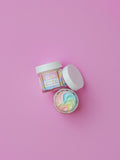 AMNH "Unicorn Dreams" Plumping Lip Mask with whipped rainbow formula in open jar, hydrating vegan lip treatment, clean beauty, cruelty free, natural ingredients, female owned brand, nourishing lip care, moisturizing overnight lip mask, pastel skincare product