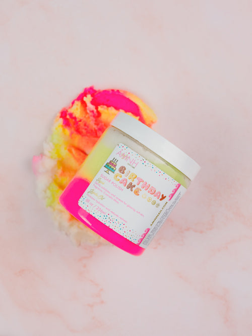 Birthday Cake Sugar Scrub by AMINNAH in a reusable jar with colorful whipped sugar scrub on a soft pink background. Clean beauty, cruelty-free, vegan skincare made with natural ingredients by a female-owned brand for gentle exfoliation and glowing, hydrated skin.