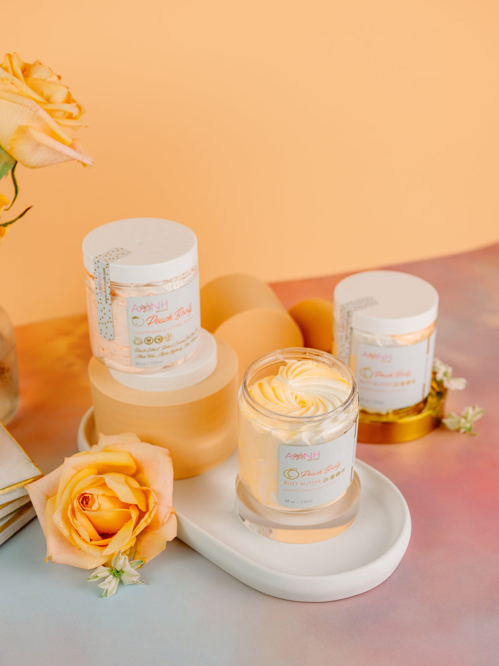 Peach Booty Bundle clean beauty skincare set featuring cruelty-free, vegan body care made with natural ingredients, including whipped body butter, body oil, and body scrub from a female-owned brand.