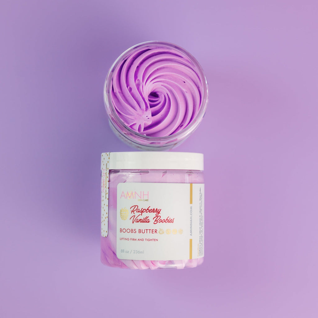 AMINNAH My Iced Gems Boob Butter in an open jar with purple whipped body butter swirled on a soft lavender background. Clean beauty, cruelty-free, vegan, made with naturally derived ingredients, and crafted by a female-owned brand. Available at Tree of Life Grocers.