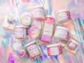 "Unicorn Dreams" Bundle featuring luxurious whipped body butter, sugar scrub, and nourishing body oil with a sweet pink sugar and cotton candy fragrance. Clean beauty gift set made with natural ingredients, vegan, cruelty-free, paraben-free, and gluten-free formulas in recyclable packaging. Premium self-care skincare from a female-owned brand for soft, radiant, hydrated skin.