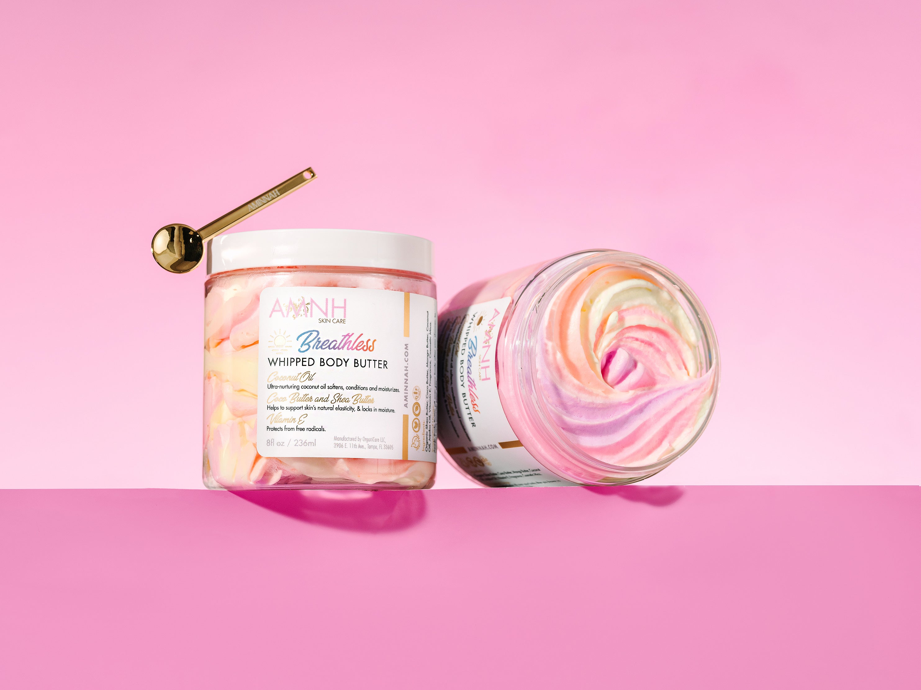 AMINNAH "Breathless" Whipped Body Butter in an 8 oz jar with a whipped pink and cream swirl, made with natural ingredients including organic shea butter, cocoa butter, mango butter, coconut oil, jojoba oil, and vitamin E. Clean beauty moisturizer that is vegan, cruelty free, gluten free, paraben free, from a female-owned brand for soft, deeply hydrated skin.