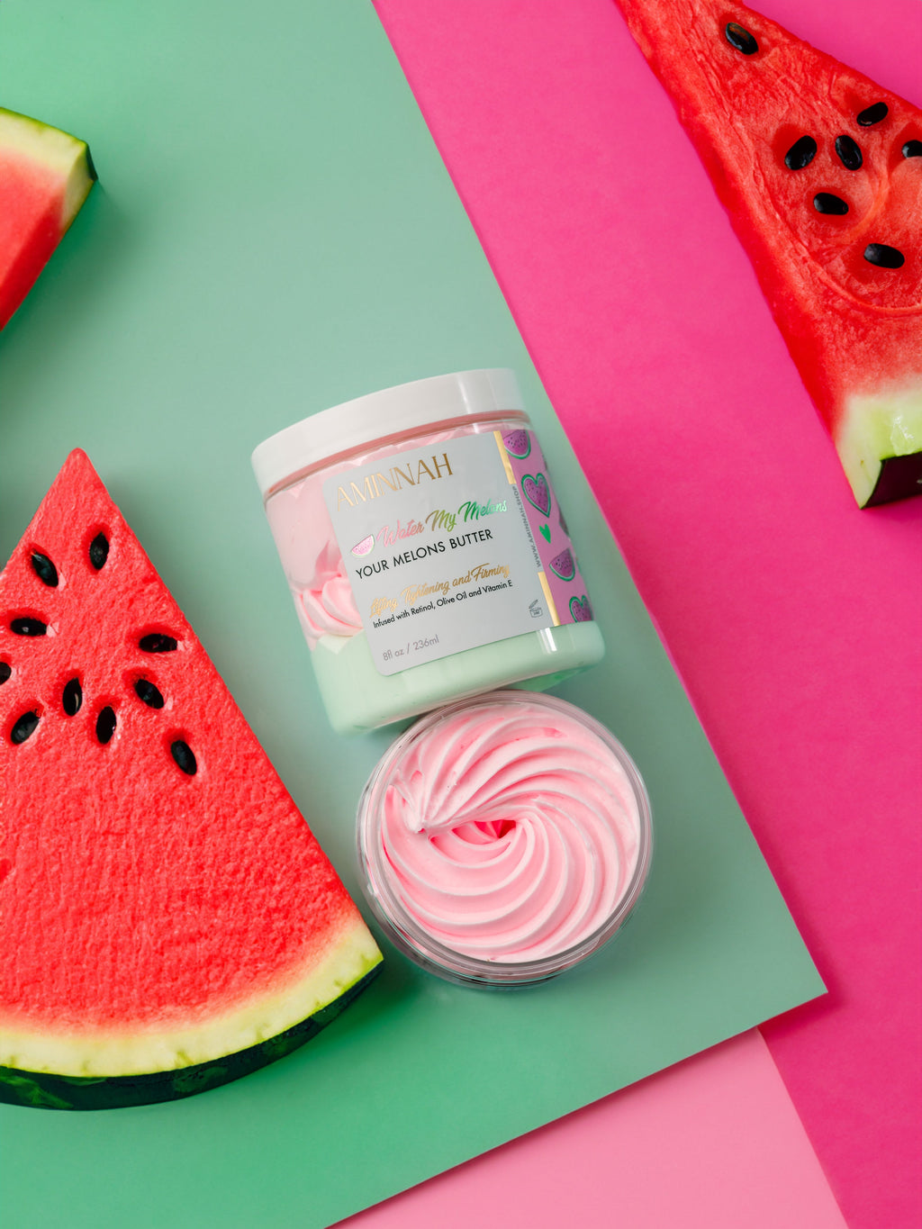 "Water My Melons" Boob Butter with whipped pink moisturizer and fresh watermelon slices. Clean beauty, cruelty-free, vegan skincare made with natural ingredients by a female-owned brand. Enriched with watermelon extract, vitamin E, retinol, and olive oil to help hydrate, nourish, brighten, firm, and soften skin for a healthy, radiant glow.