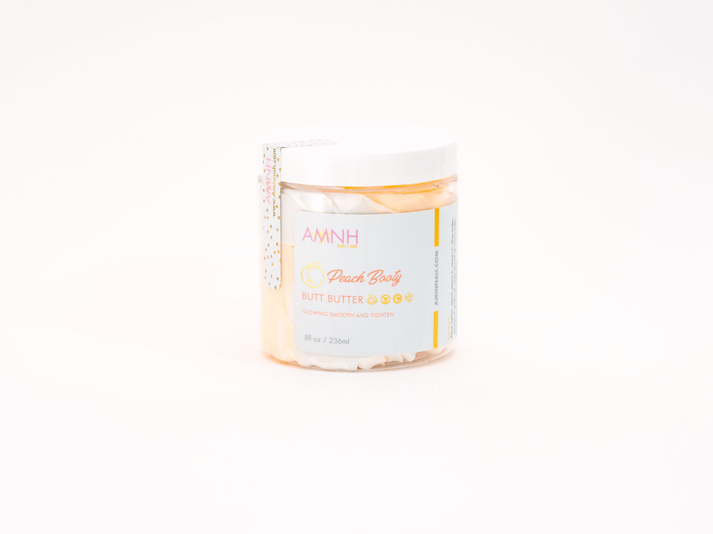 AMINNAH "Peach Booty" Tightening & Lifting Butt Butter in an 8 oz jar with white whipped body butter on a white background. Cruelty-free, vegan body moisturizer for smoothing, hydrating, and nourishing all skin types.