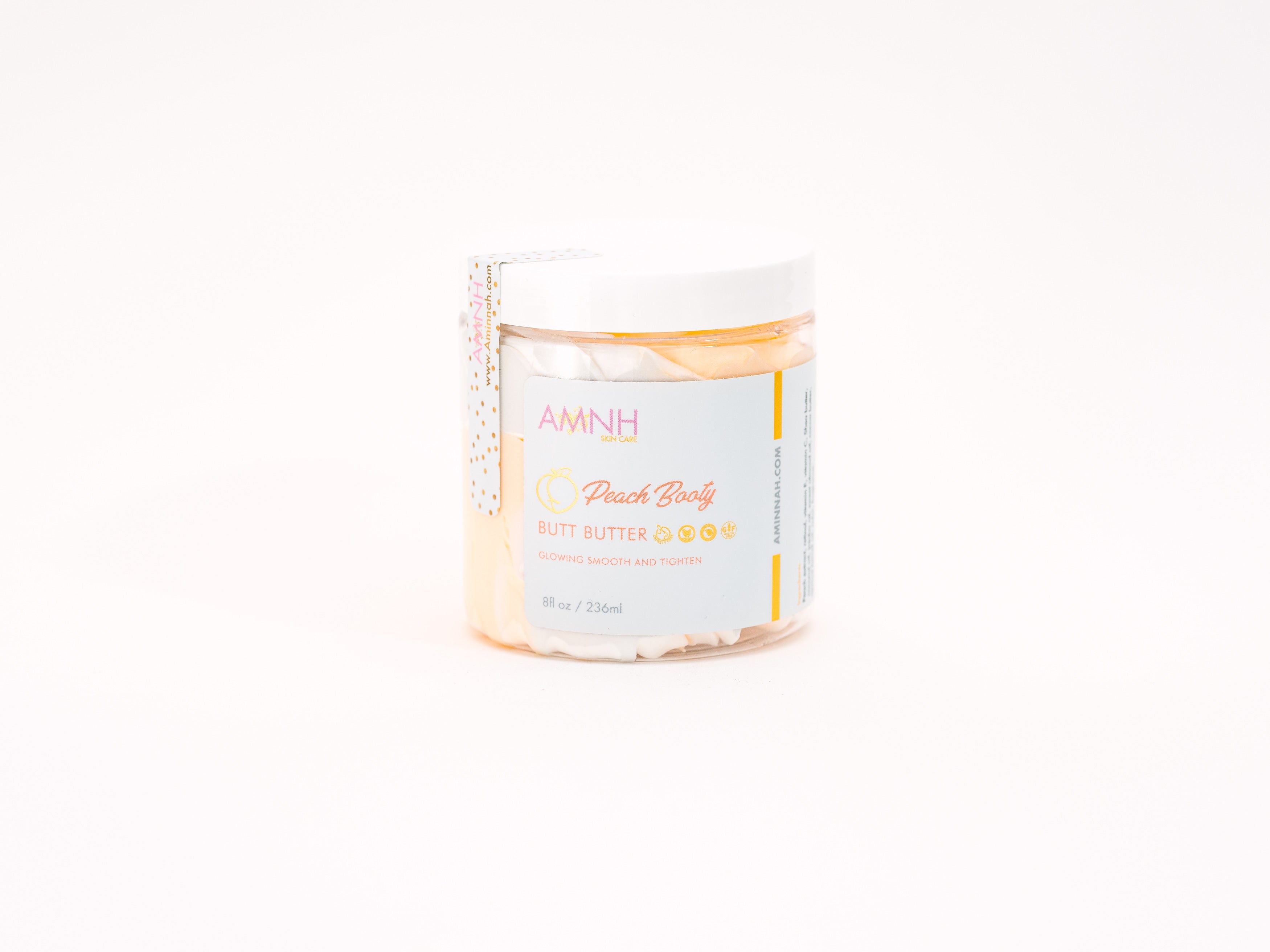 AMINNAH "Peach Booty" Tightening & Lifting Butt Butter in an 8 oz jar with white whipped body butter on a white background. Cruelty-free, vegan body moisturizer for smoothing, hydrating, and nourishing all skin types.