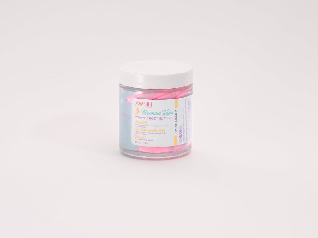 "Mermaid Kisses" Whipped Body Butter in a luxurious glass jar with fluffy pastel pink and blue whipped body butter on a clean white background. Premium clean beauty skincare made with natural ingredients to deeply nourish and moisturize dry skin. Cruelty-free, vegan, paraben-free, and gluten-free formula from a female-owned brand, featuring recyclable packaging for eco-conscious, luxurious self-care and healthy, radiant-looking skin.