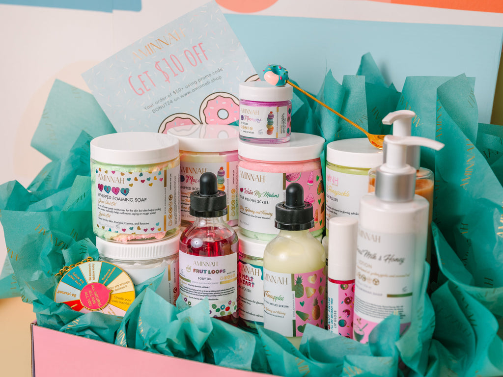 Aminnah TikTok Mystery Box featuring 10 luxury clean beauty and skincare products in recyclable packaging. Cruelty-free, vegan, paraben-free, gluten-free, natural ingredients, female-owned brand, self-care gift set with body scrub, body butter, body oil, soap, serum, and skincare essentials.