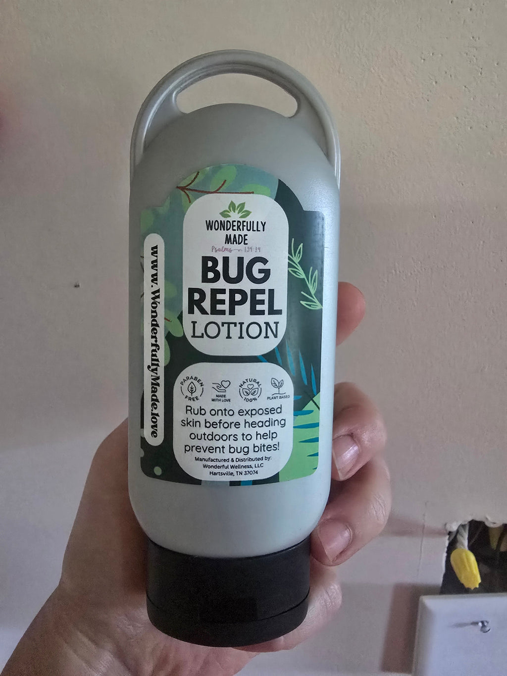 Wonderfully Made Bug Repel Lotion bottle with natural essential oils, organic ingredients, plant-based formula, no parabens and natural preservative for outdoor insect and mosquito protection.