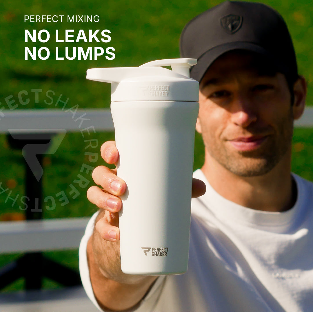 A man in a black cap holds up a white Perfect Shaker shaker bottle outdoors, with promotional text reading 'PERFECT MIXING NO LEAKS NO LUMPS' on the left side.