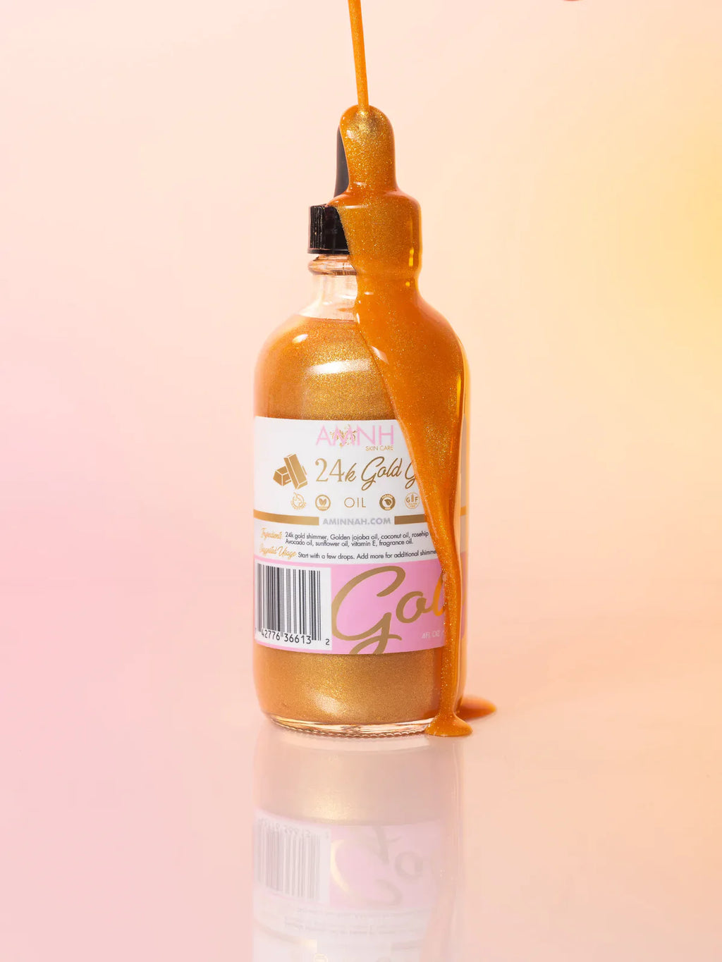 24K Gold Glow Body Oil in glass dropper bottle with shimmering gold body oil, made with natural ingredients for radiant, nourished skin. Clean beauty, cruelty-free, vegan skincare from a female-owned brand, ideal for daily hydration and a luminous glow.