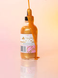 24K Gold Glow Body Oil in glass dropper bottle with shimmering gold body oil, made with natural ingredients for radiant, nourished skin. Clean beauty, cruelty-free, vegan skincare from a female-owned brand, ideal for daily hydration and a luminous glow.