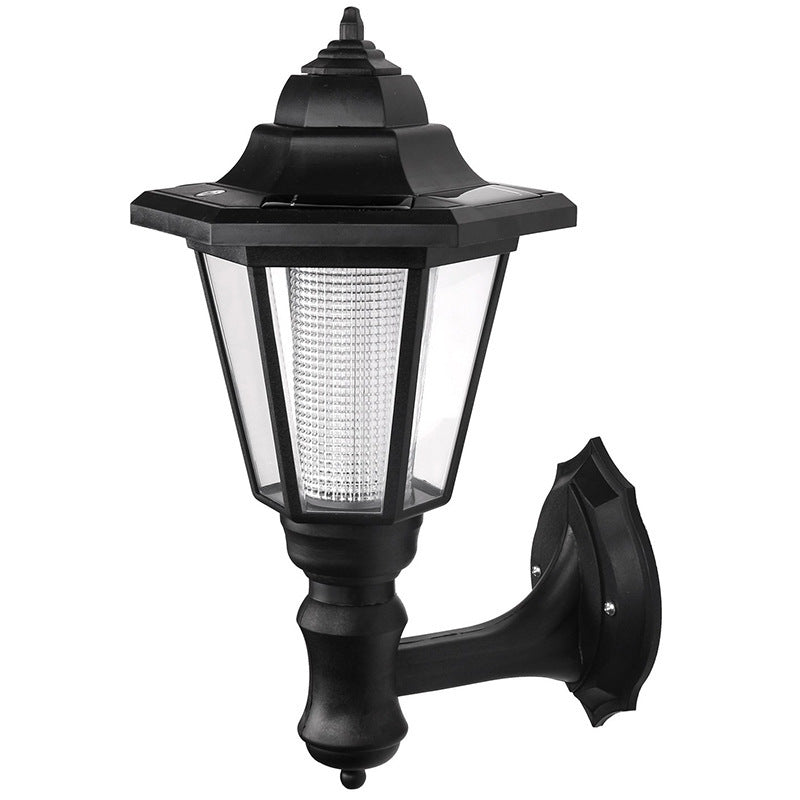 Black outdoor wall light fixture on a white background