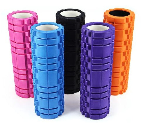 Five foam rollers in pink, blue, black, purple, and orange on a white background