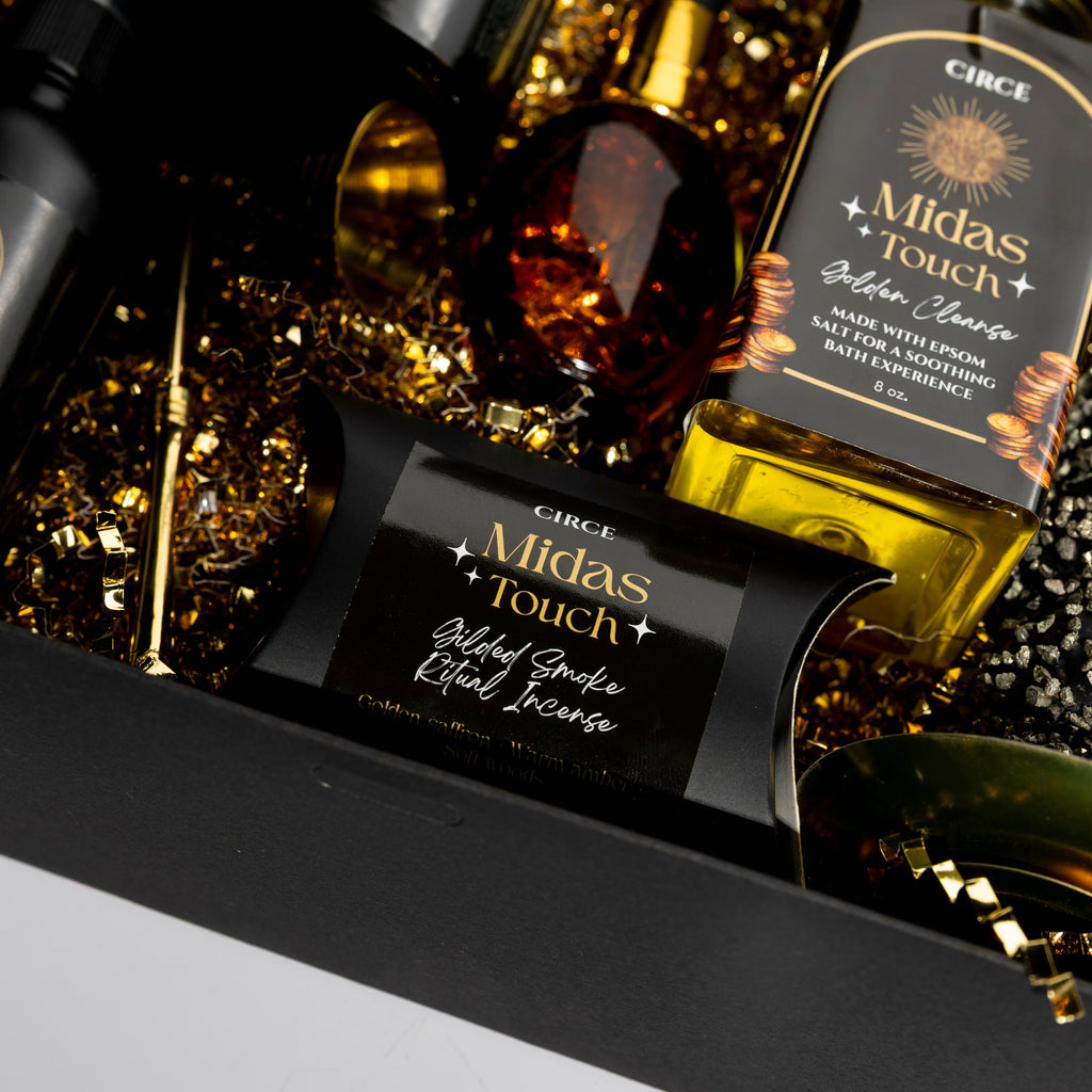 Circe Midas Touch Ritual Collection abundance manifestation gift set featuring Golden Clear Bath Cleanse, Gilded Smoke Ritual Incense and luxury spiritual self-care products in elegant black and gold packaging.