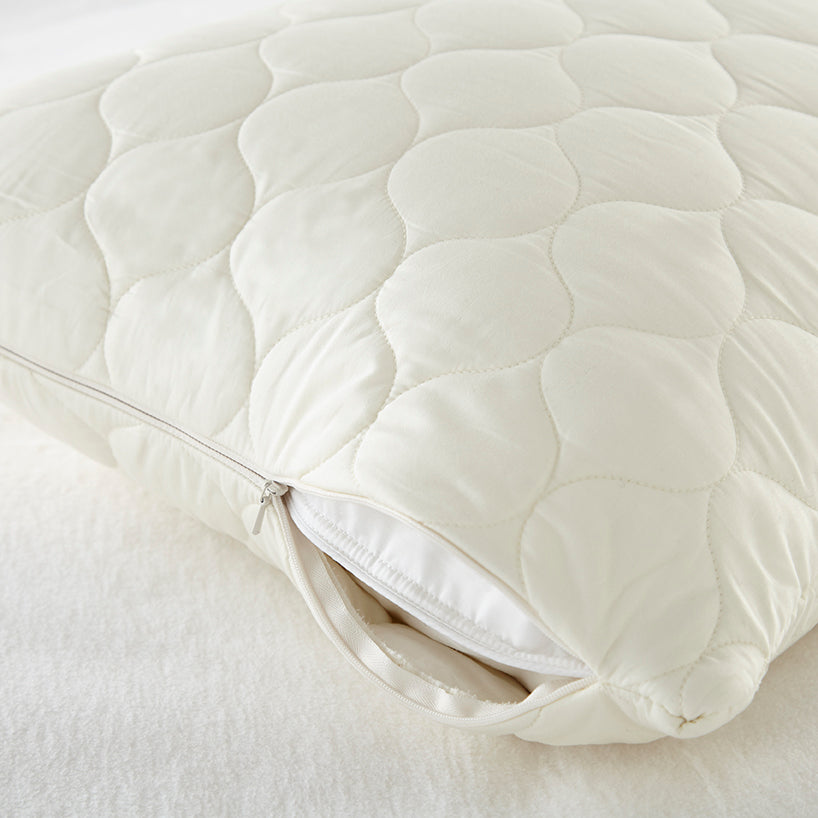 Quilted mattress pad on a bed with a zipper, Organic Cotton Quilted Pillow Protectors