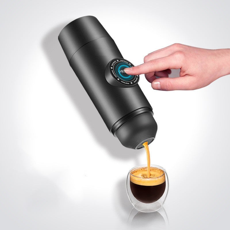 Portable mini rechargeable espresso maker pouring fresh espresso into a double-wall glass, featuring a one-touch control, compact handheld design, and matte black finish for travel, camping, office, home, and on-the-go coffee brewing.