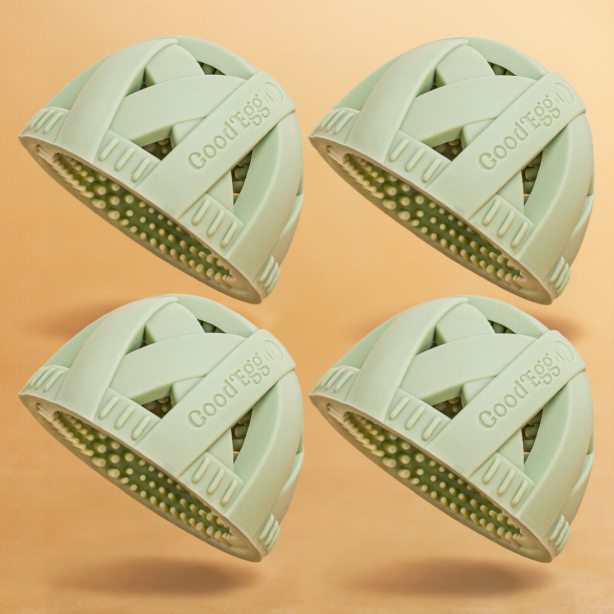 Large green GoodEgg reusable scrub balls with textured silicone bristles for cleaning dishes, cookware, kitchen surfaces, fruits, vegetables, and household items, shown in a convenient 4-pack.