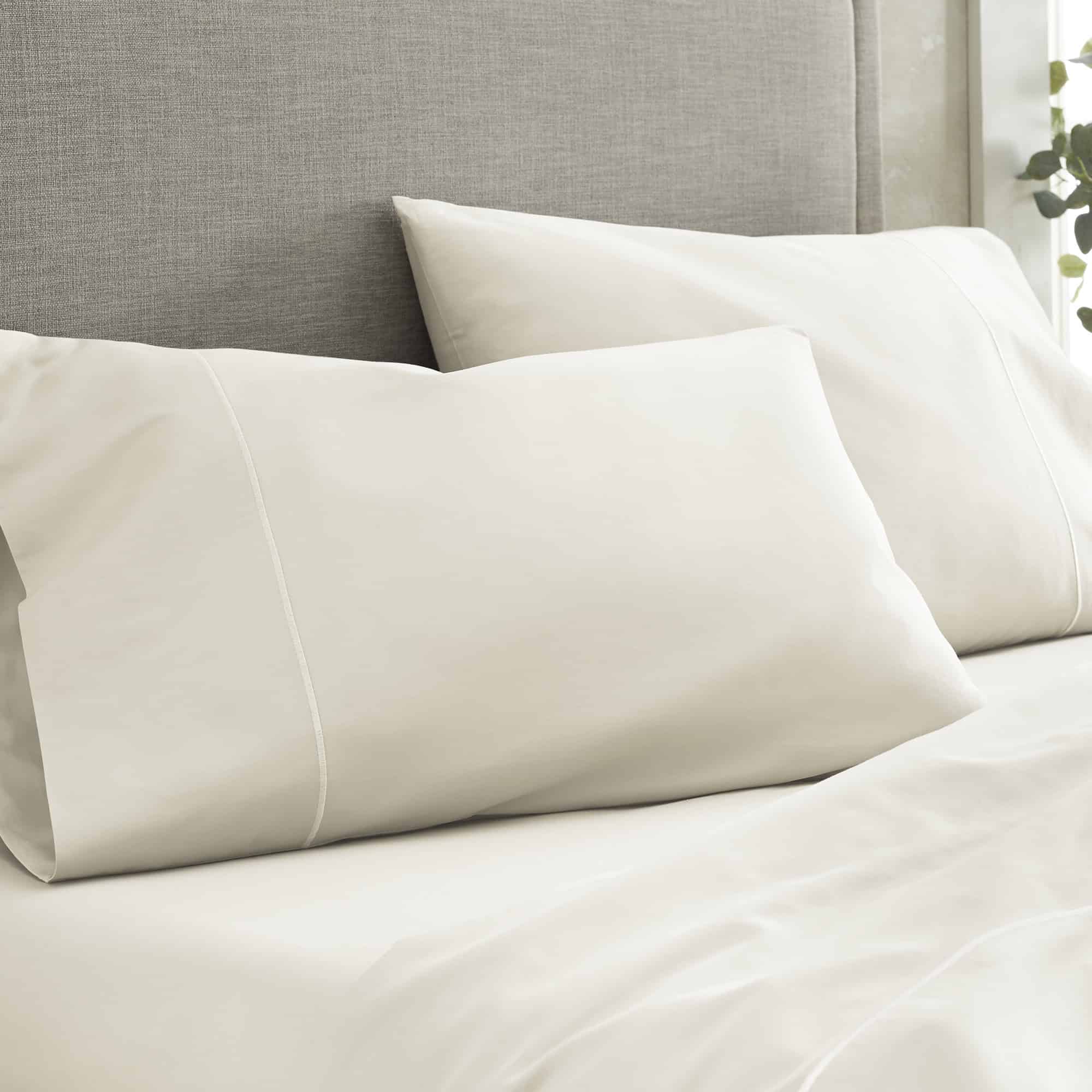 Two beige pillows on a bed with a neutral headboard. 100% GOTS-Certified &amp; Fairtrade-Certified Organic Cotton
Made in India
High quality, dense 500-thread-count sateen weave becomes luxuriously soft with washing
Durable elastic band
Non-toxic, hypoallergenic, naturally breathable, and cooling
16" deep pocket, ideal for plush mattresses
Easy Care, Machine Wash and Tumble Dry