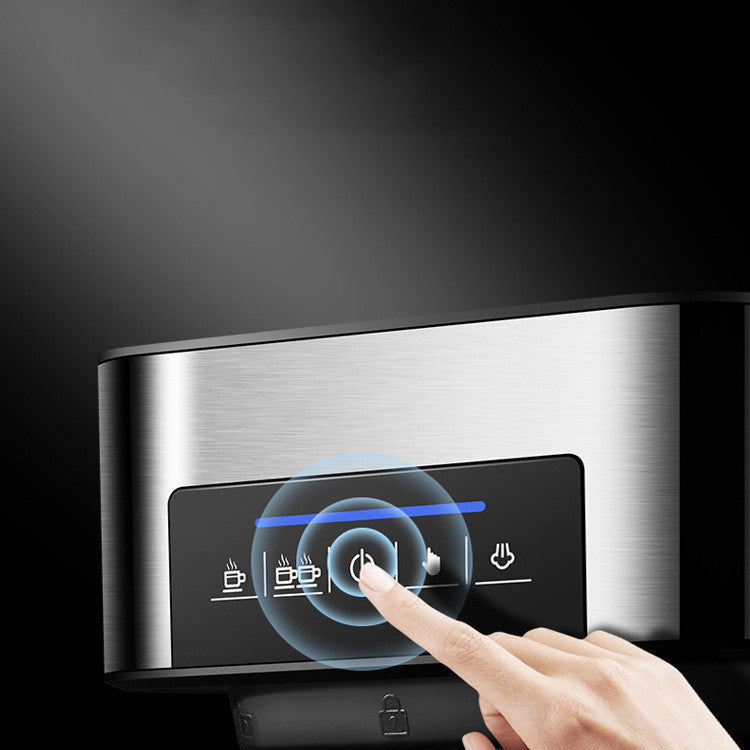 Close-up of a finger pressing the illuminated touch control panel on a stainless steel espresso machine, highlighting its modern digital interface and one-touch operation.
