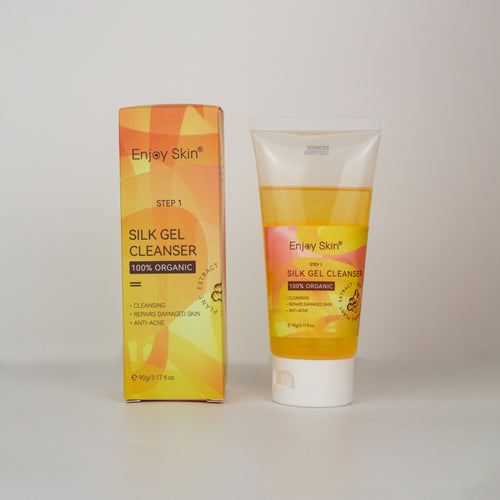Enjoy Skin Silk Gel Cleanser tube and packaging displayed on a light gray background, part of the 5-Piece Organic Vegan Turmeric Skincare Set for anti-acne care, brightening, hydration, and healthier-looking skin.