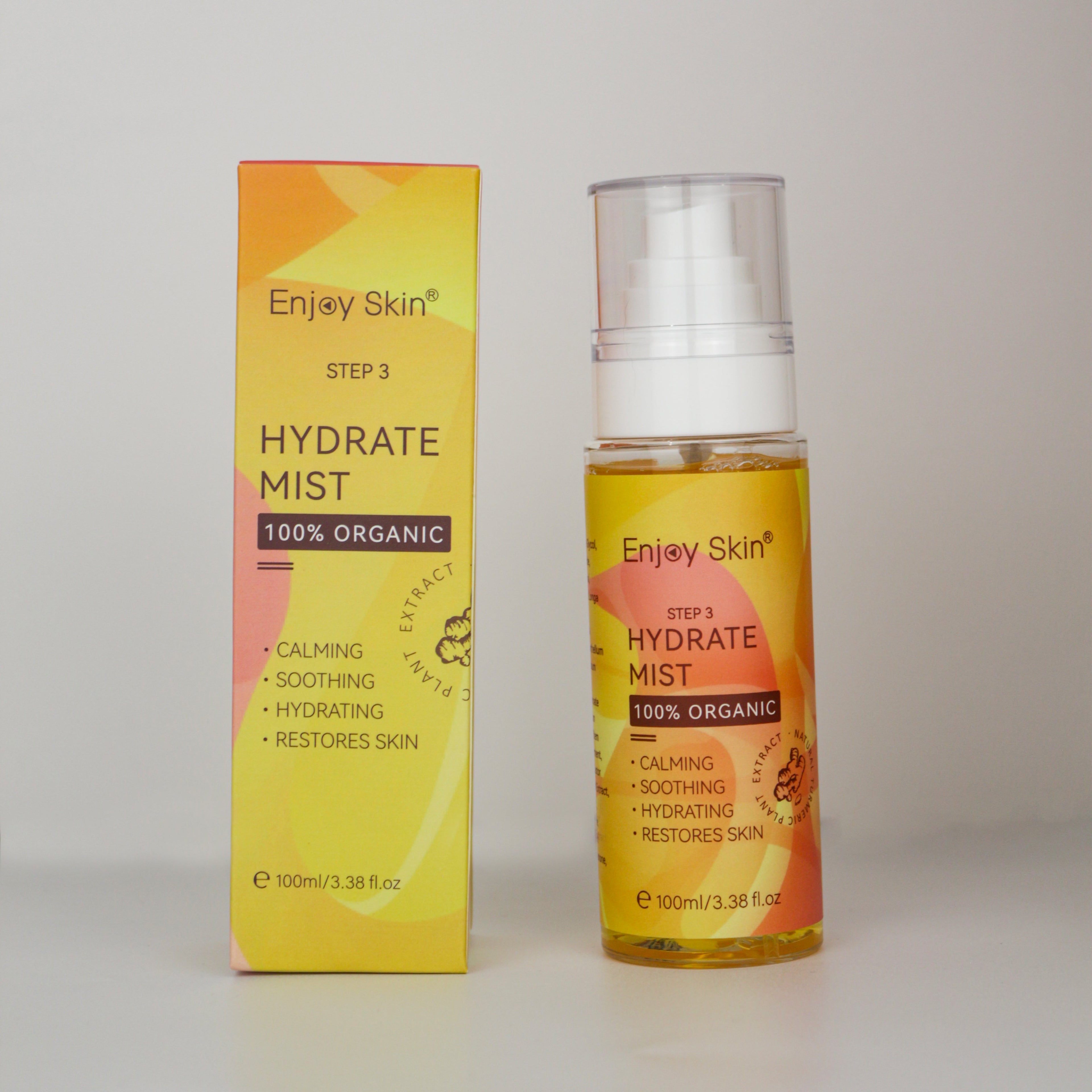 Enjoy Skin Hydrate Mist bottle with matching product packaging displayed on a light gray background. Part of the 5-Piece Organic Vegan Turmeric Skincare Set, this hydrating facial mist helps calm, soothe, and moisturize skin while supporting a brighter, healthier-looking complexion.