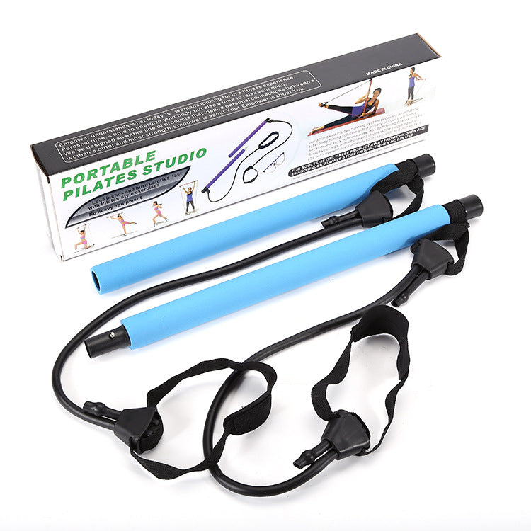 Portable Pilates studio with blue resistance bands and packaging on a white background