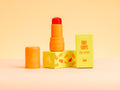Fruit Loops Lollipop Lips & Cheeks Tint in Coral by Aminnah, clean beauty vegan lip and cheek tint with natural ingredients, cruelty-free makeup from a female-owned brand for a fresh radiant glow.