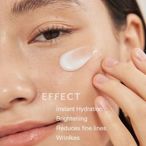 Person applying moisturizing face cream to cheek with text highlighting benefits including instant hydration, brightening, reduced fine lines, and wrinkle care.