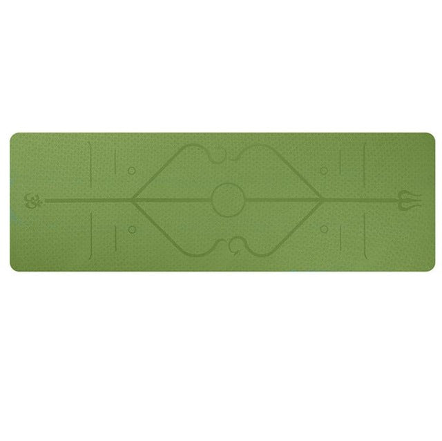 Green yoga mat with geometric design on a white background