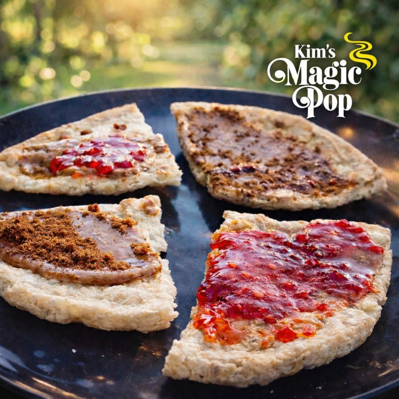 Four triangular Kim's Magic Pop rice cakes topped with assorted sweet spreads including strawberry jam, chocolate, cinnamon sugar, and caramel, arranged on a black plate with the Kim's Magic Pop logo in the background.