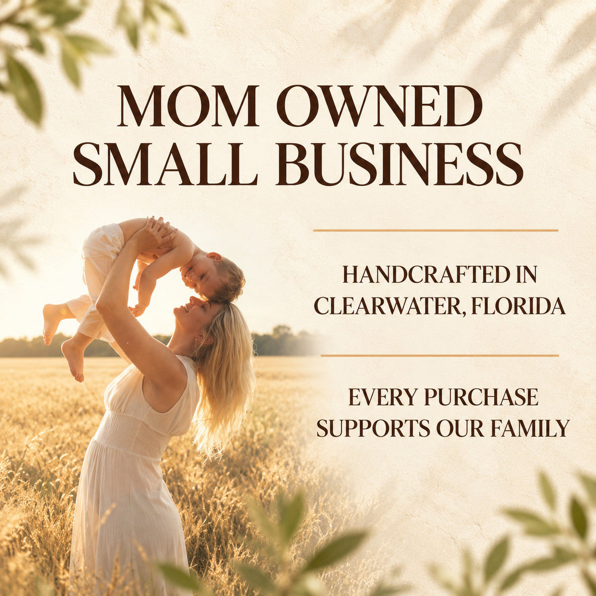 A promotional graphic with the text 'MOM OWNED SMALL BUSINESS' over a warm-toned photo of a woman in a white dress holding a child above her head in a sunlit field. Additional text reads 'HANDCRAFTED IN CLEARWATER, FLORIDA' and 'EVERY PURCHASE SUPPORTS OUR FAMILY'.
